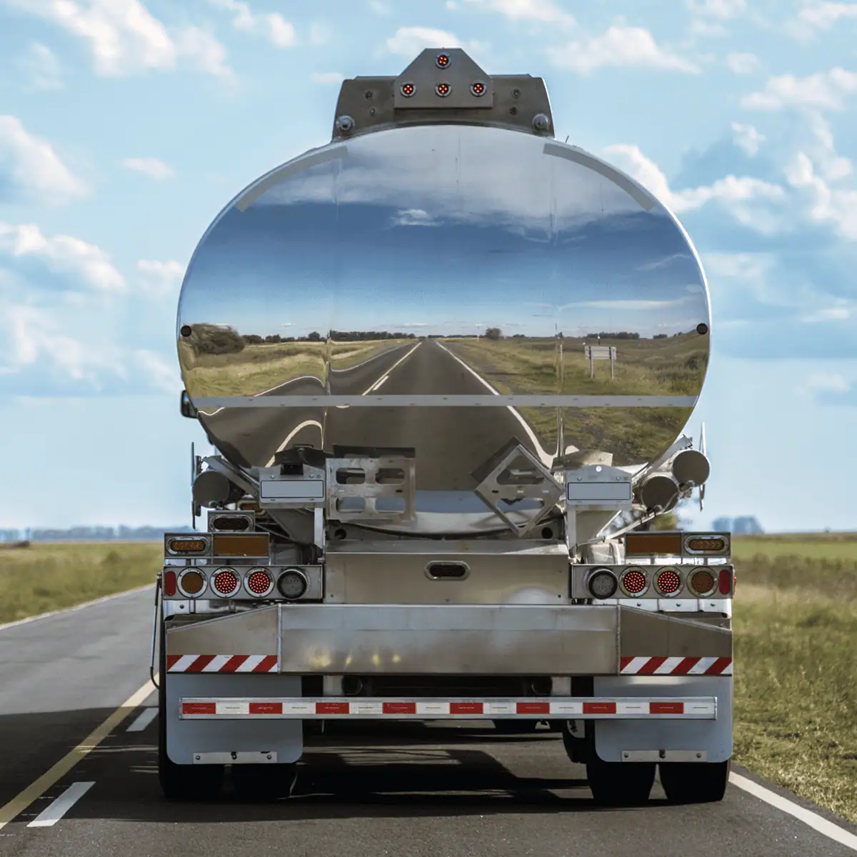 road reflection in back of fuel truck