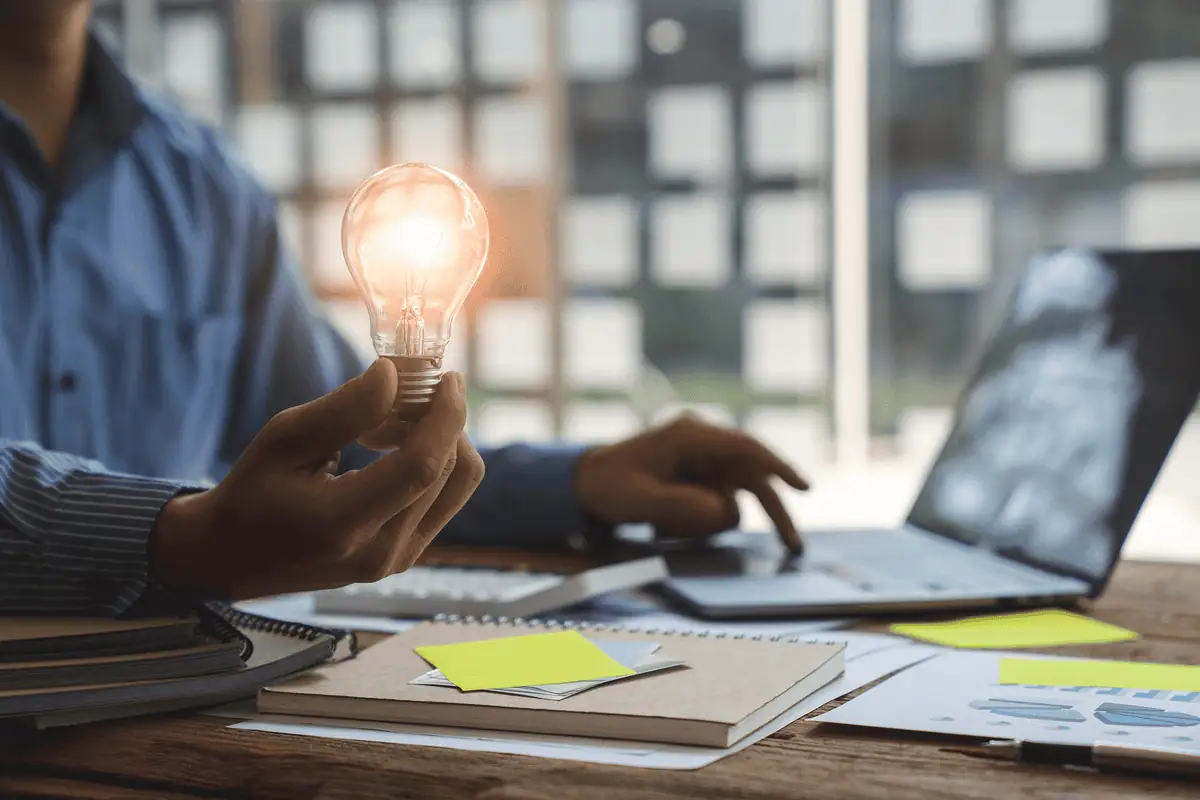 Person holding a light bulb